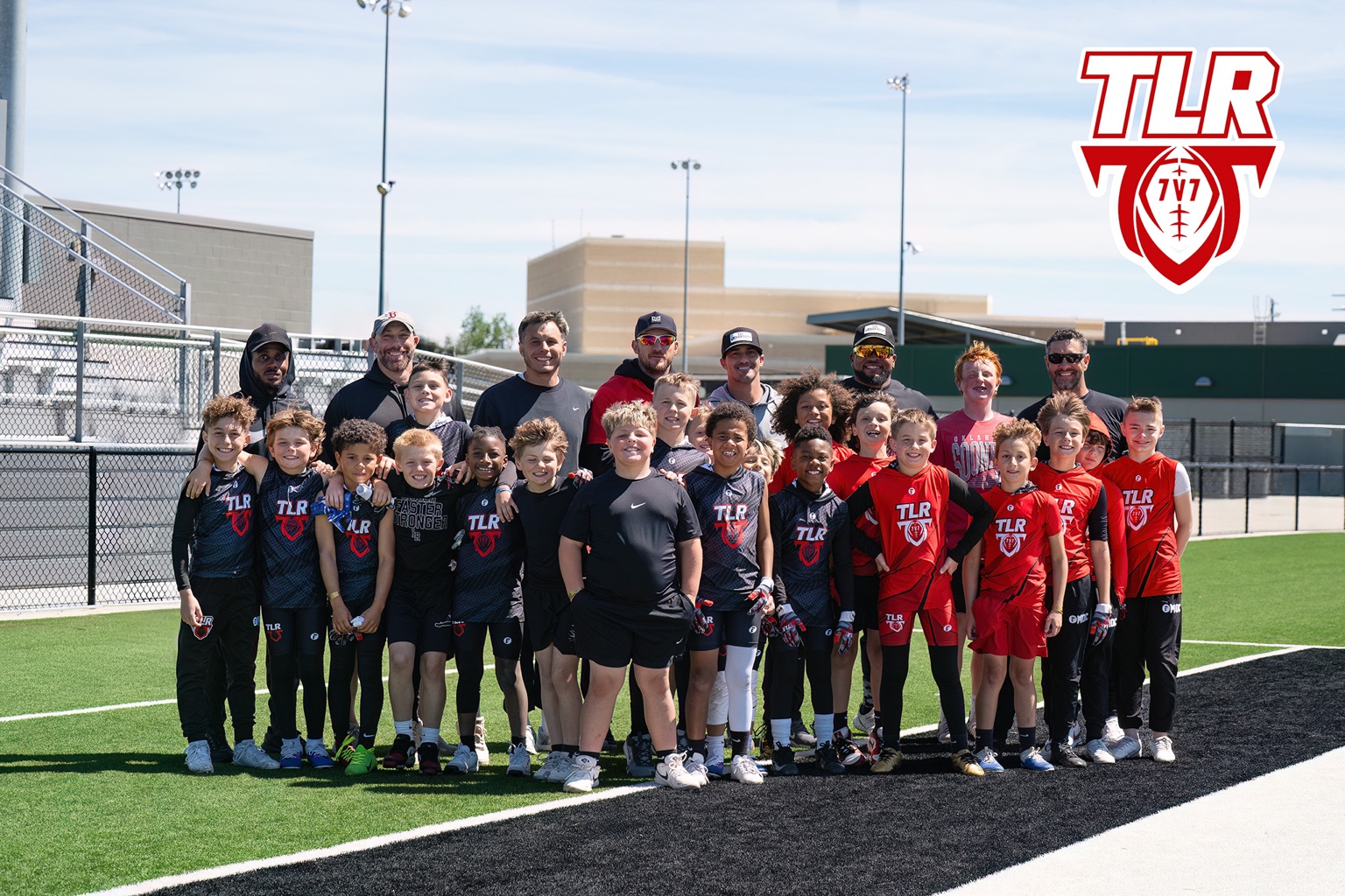TLR 7v7 athletes and coaches together on the football field